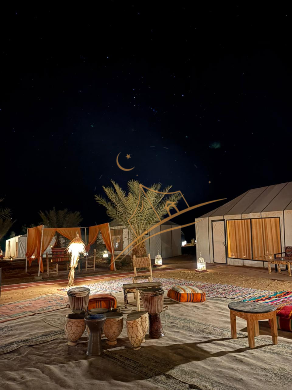 Traditional Berber drums and woven rugs set beneath the palms for an evening of music